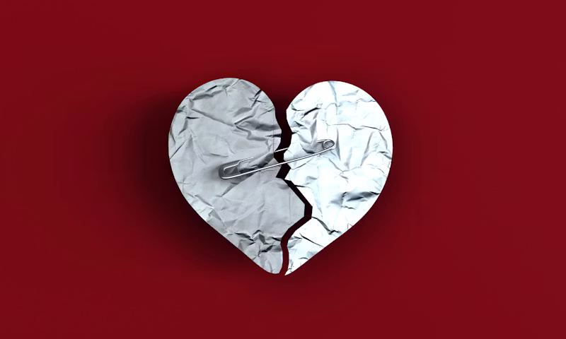 A broken heart on a red background