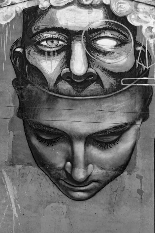 Grayscale illustration of two overlapping faces